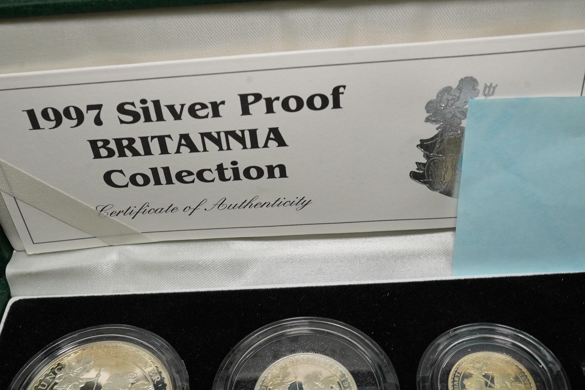 Royal Mint UK QEII coins, four Britannia collection silver proof four-coin sets, 1997, 2001, 2005 and 2007, in case of issue with certificate (4)